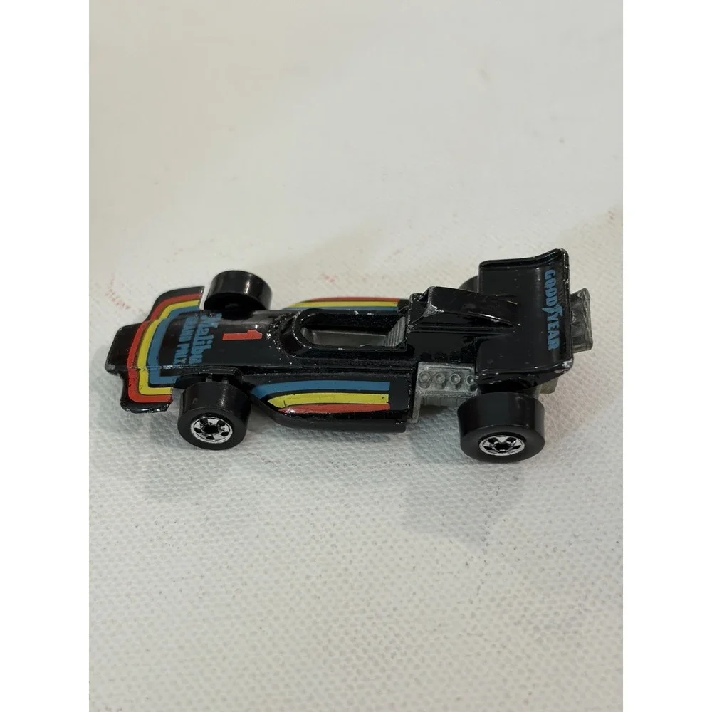 1982 Hot Wheels Malibu Grand Prix 1973 Malaysia Blackwalls Metal Base Black #1
